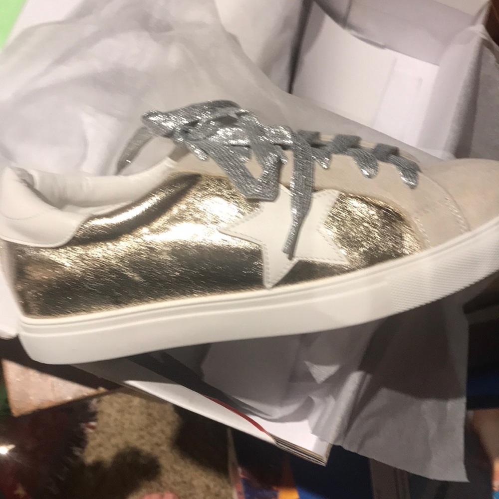 Gold and white shoes